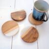 4 Marble and wood Drink Coasters on white wood with coffee cup on top