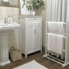 Wooden freestanding towel rail white in bathroom setting with white furniture