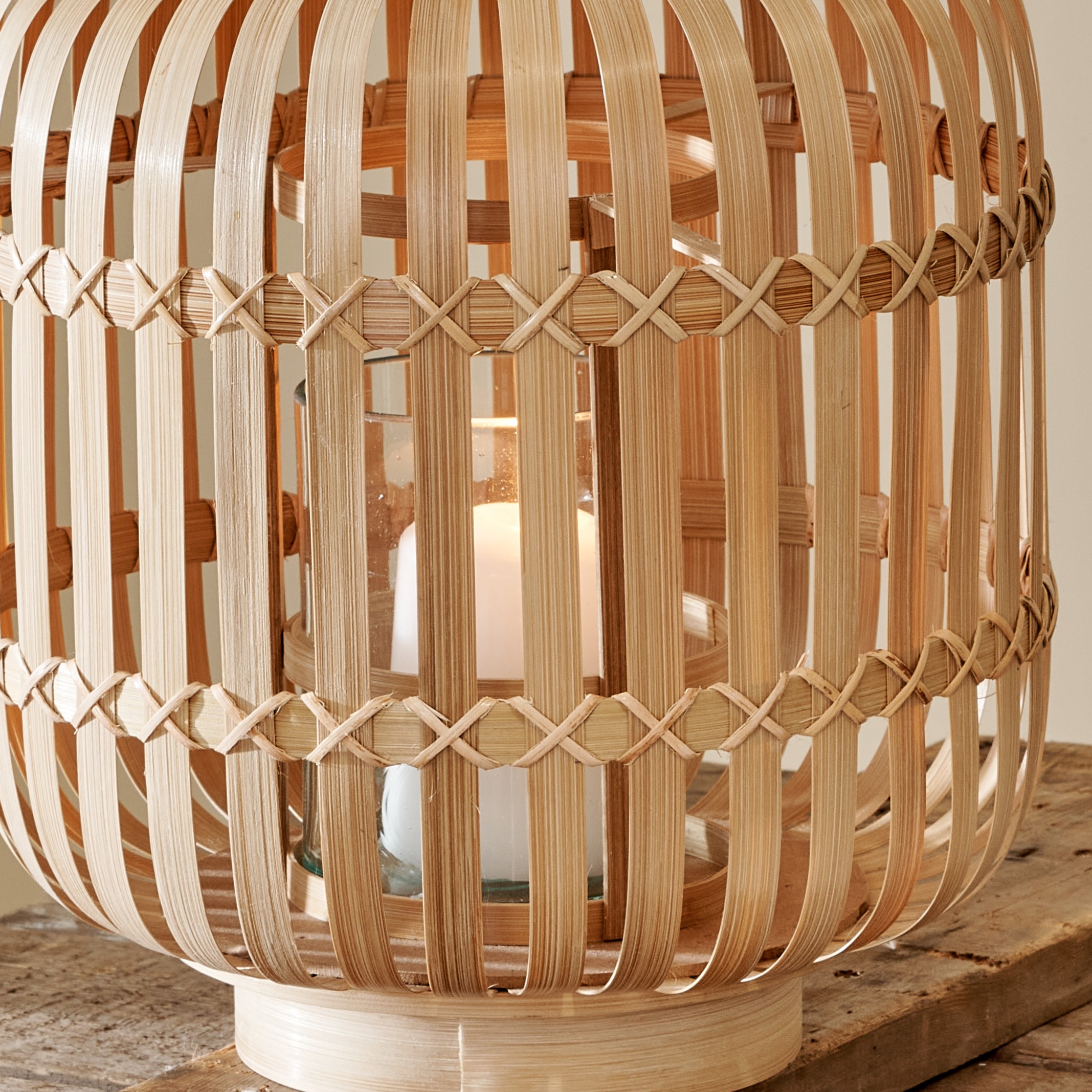 Close up of Natural Bamboo Hurricane Lantern on wooden table