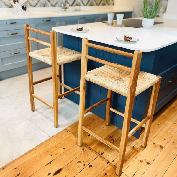 Abaca wicker kitchen stools in front of blue kitchen island
