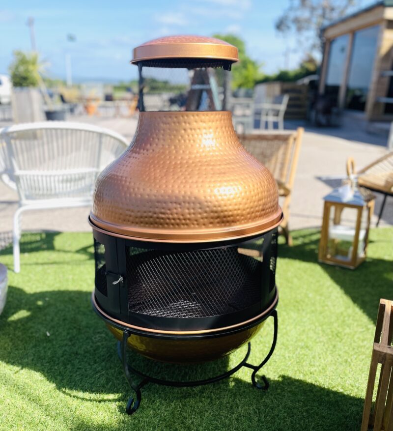 Large fire pit copper on grass