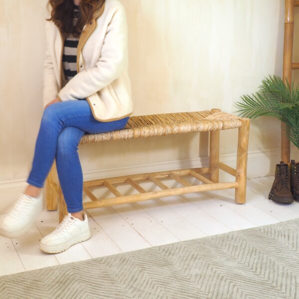 Women sat on rustic wooden bench in hallway