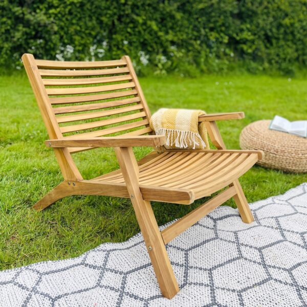 Wooden garden chair on rug