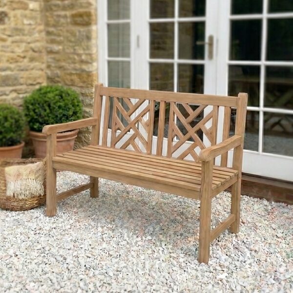 wooden garden bench on gravel patio with French doors