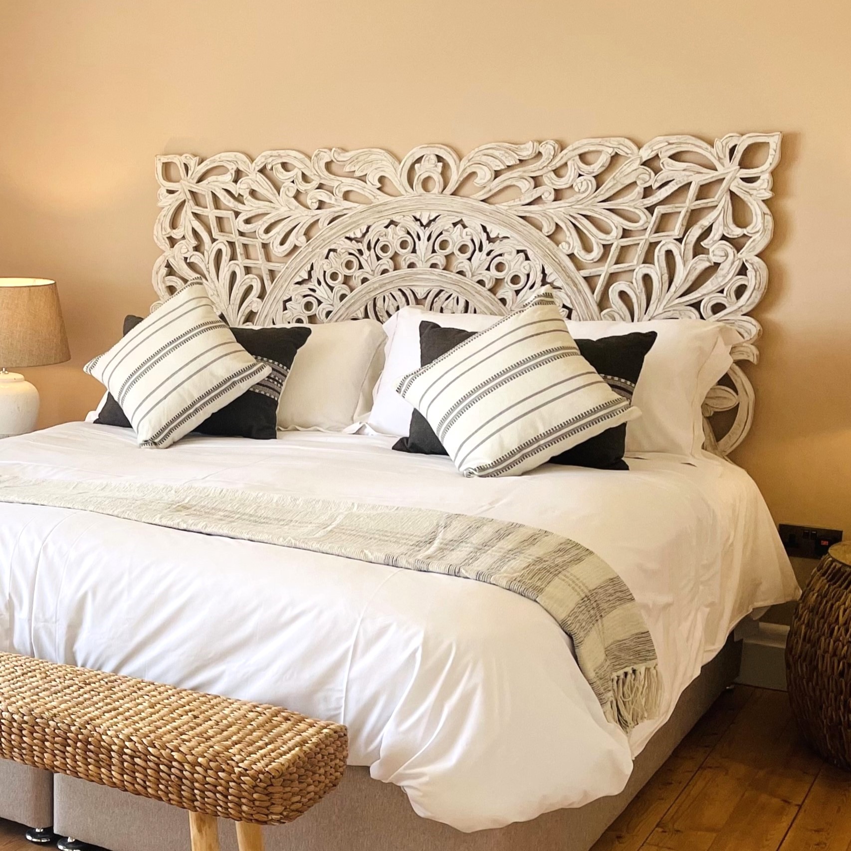 Carved Wooden Headboard White on Bed in bedroom setting