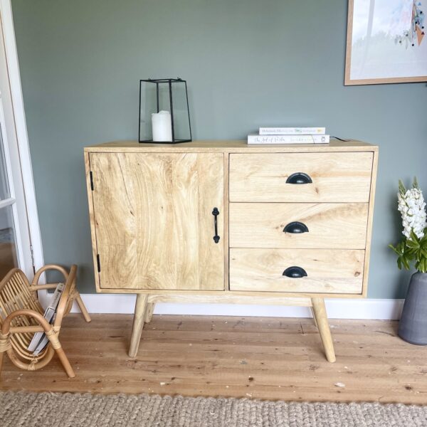 Mango wood sideboard with lantern and rug