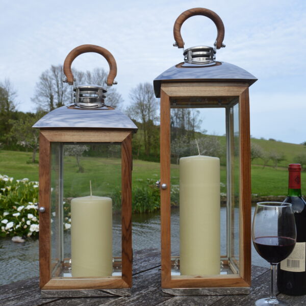 Wood garden lantern on patio with glass of wine