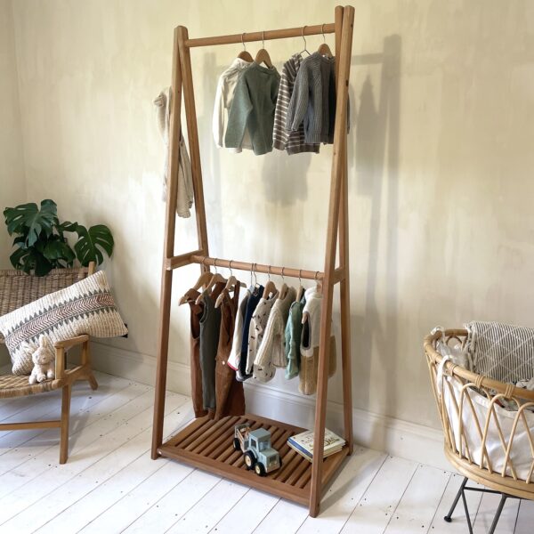 children's wardrobe in bedroom with babies cot and rattan chair