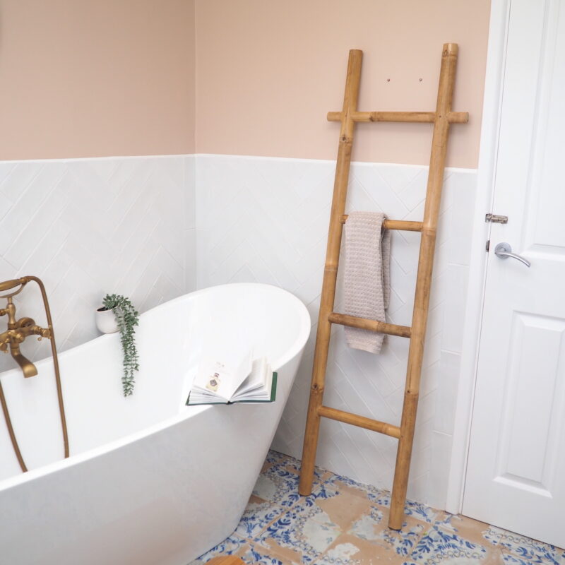 towel ladder in bathroom with bath