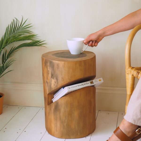 rustic coffee table with lady holding mug and plant