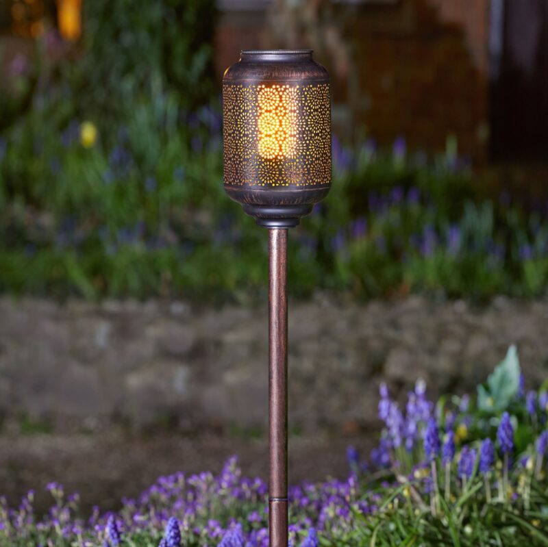 solar stake light at night in garden