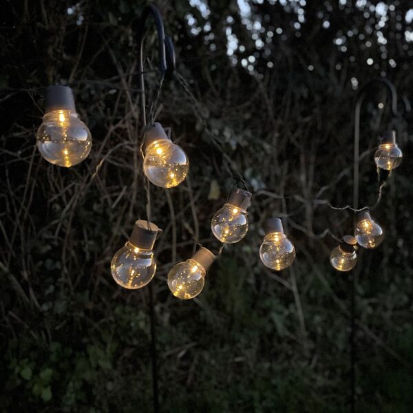 Solar powered outdoor string lights at night