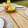 Teak wood garden dining table close up