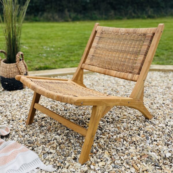 wooden garden chair with rattan on garden patio
