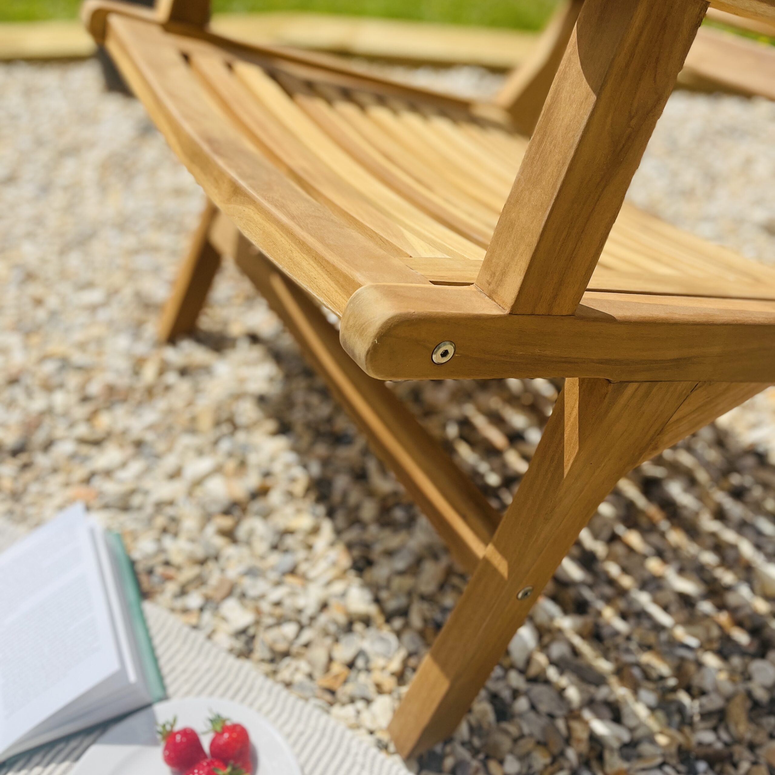 Teak garden chair detailed photo of wood on patio