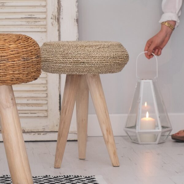 small wooden stool with candle lantern and girl hand