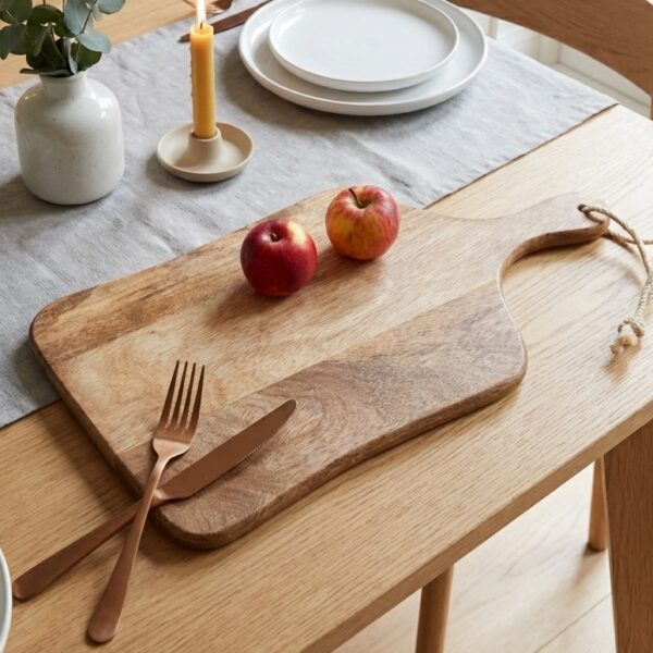 wooden chopping board on dining table with candlestick