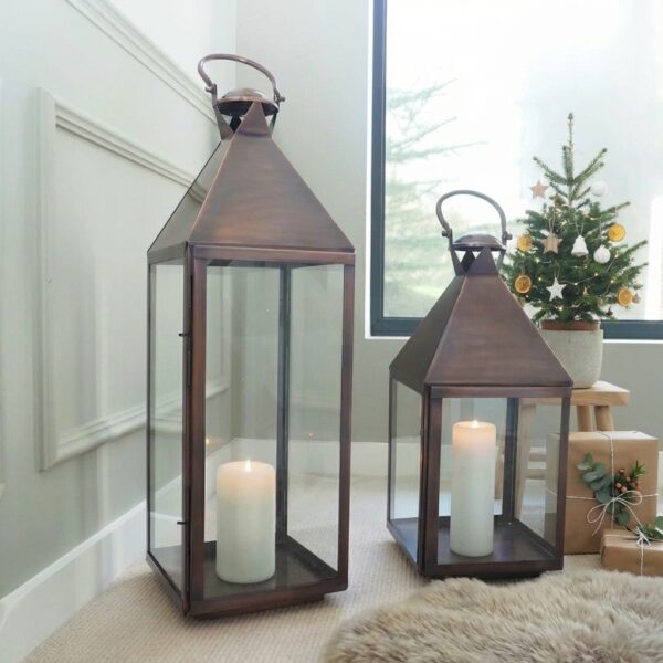 antique copper lanterns next to christmas tree