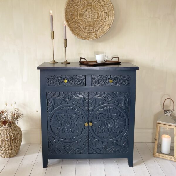 Navy sideboard in hallway with candlesticks and tray