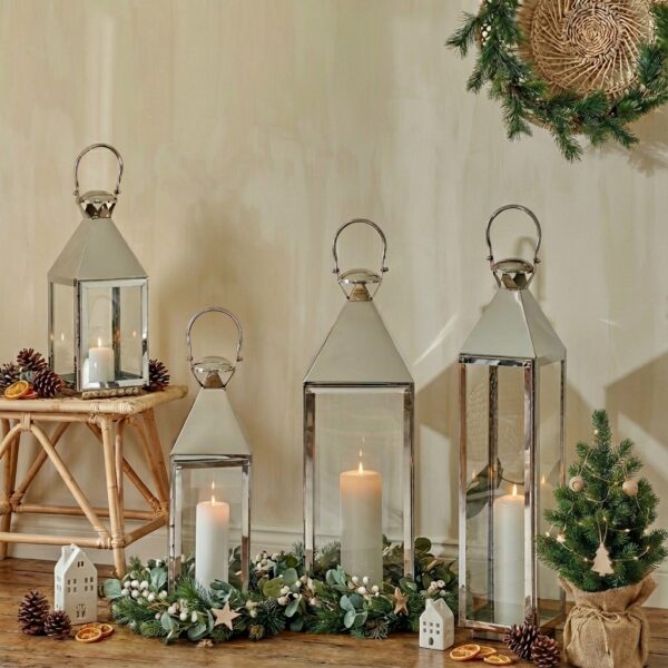 tall silver lanterns in christmas setting