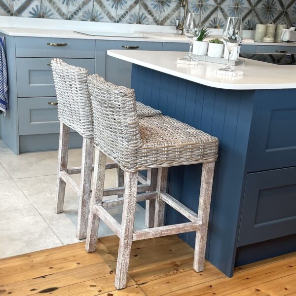 Whitewash rattan kitchen stool at kitchen island