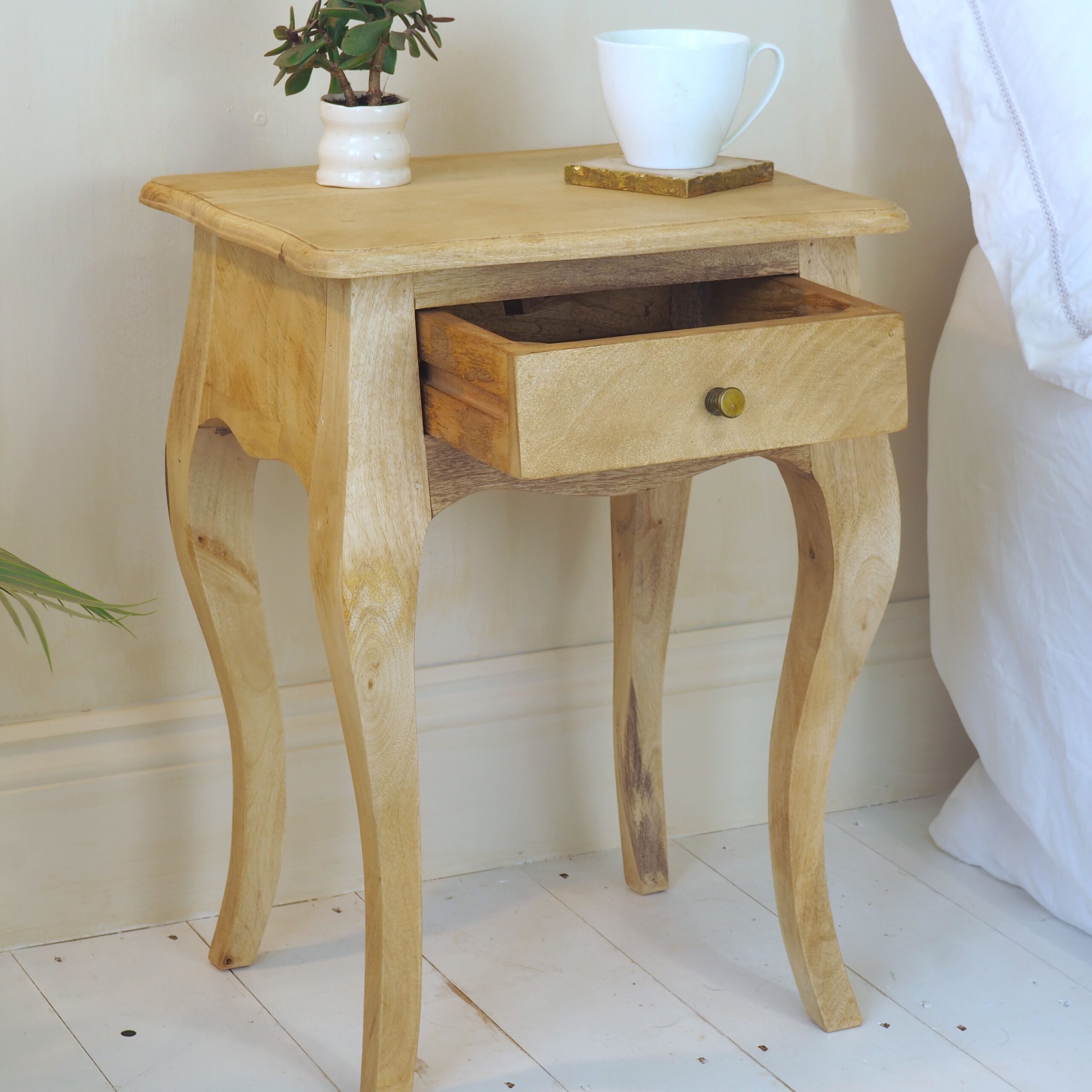 Natural Bedside Table with draw open, on white wooden floor in bedroom setting