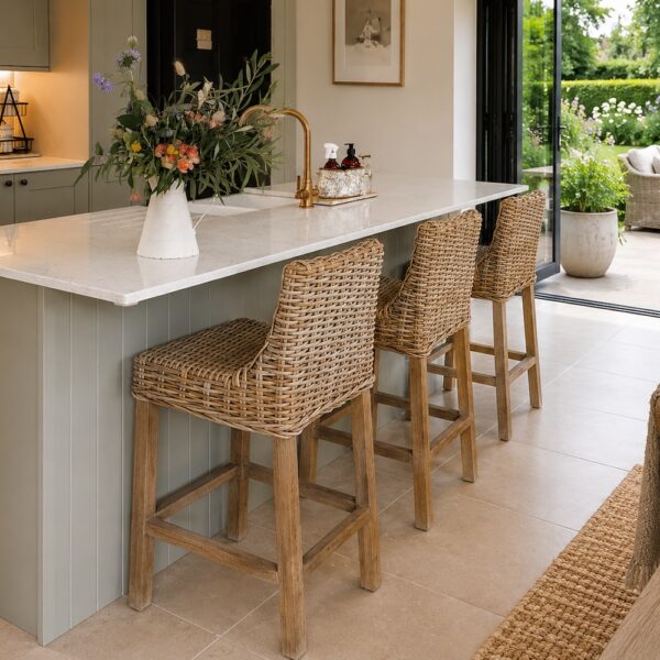 country kitchen with granite island and rattan kitchen stools