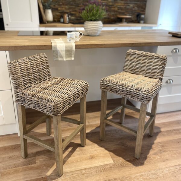 wicker bar stools in kitchen with wood floors