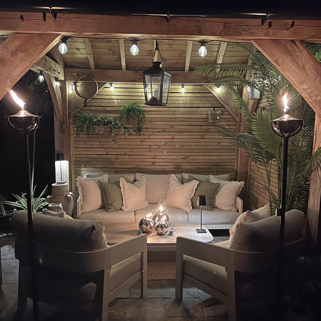 garden seating area with outdoor oil torches