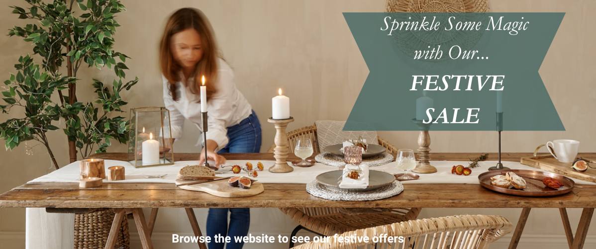 christmas dinner table setting with lady serving christmas dinner